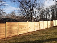 <b>6 foot Horizontal cedar stepped fencing with no spacing between the pickets with standard black post caps</b>